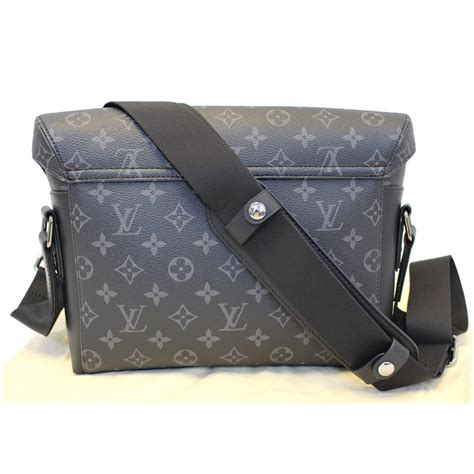 black louis vuitton messenger bag.